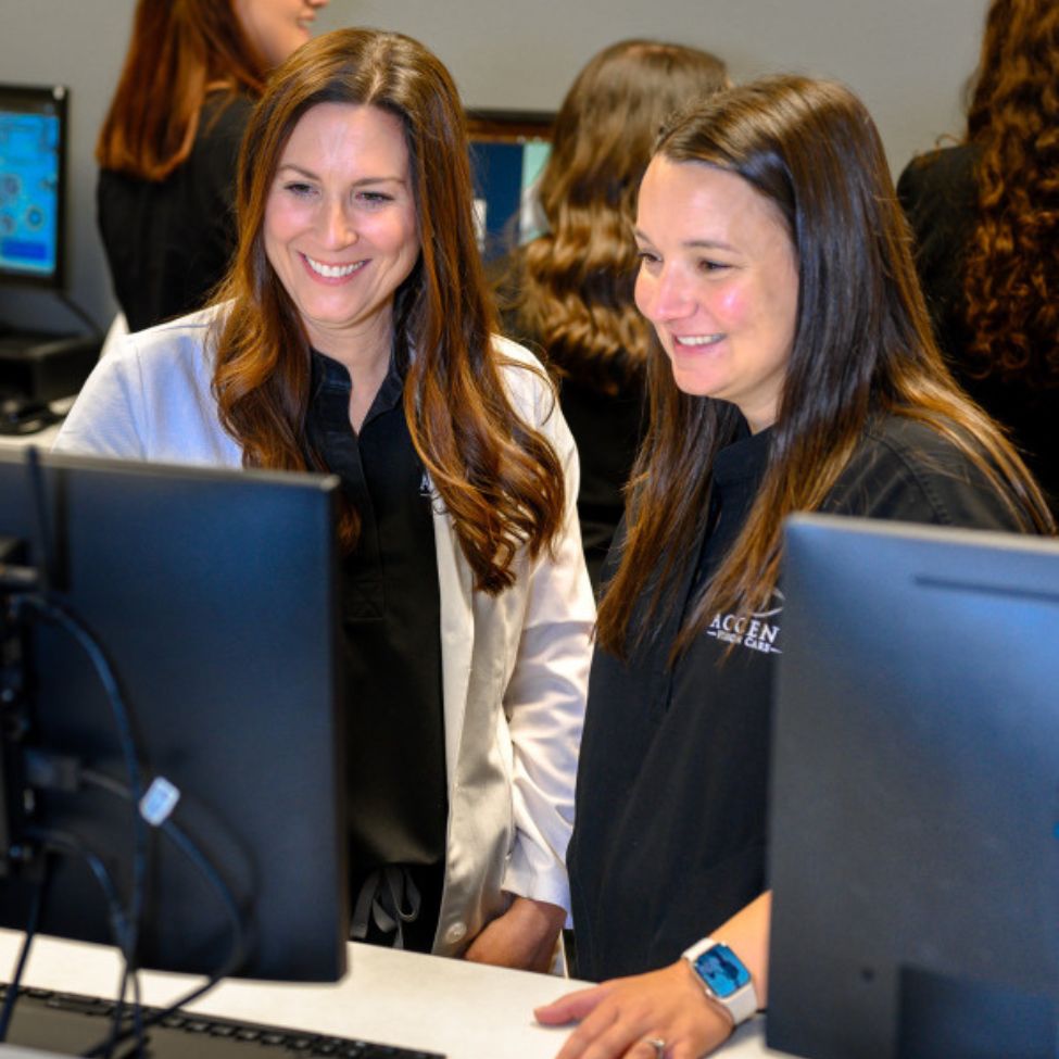 doctor and staff in front of computer