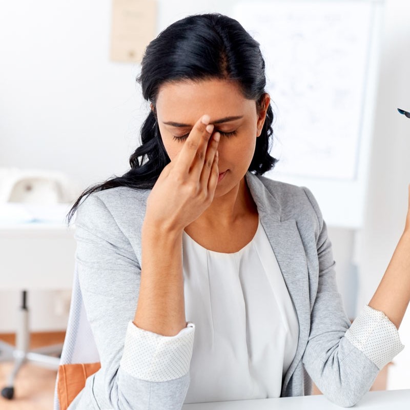 Woman suffering from dry eye symptoms